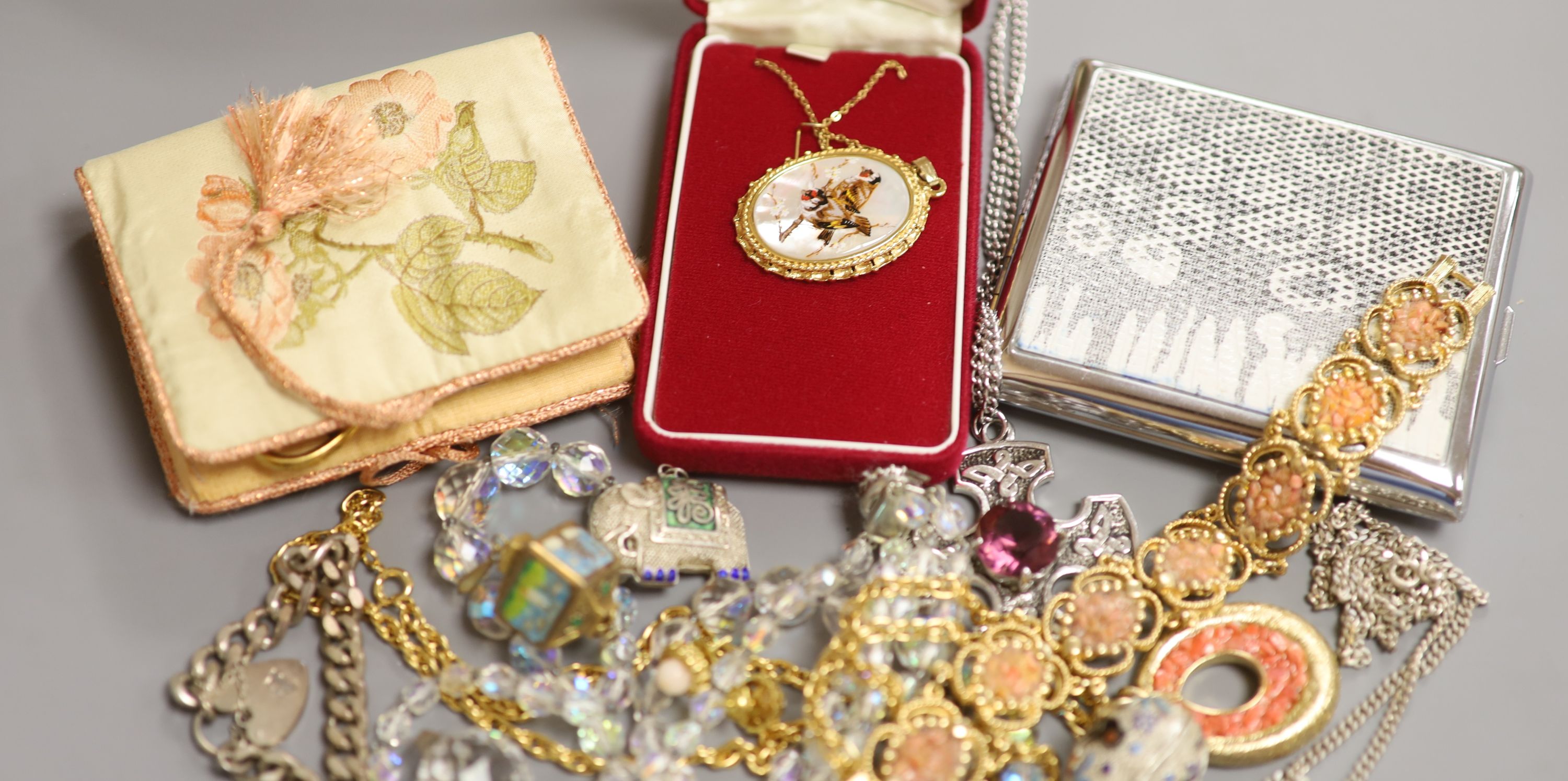 Mixed jewellery including silver bracelet, costume jewellery and a cigarette case.